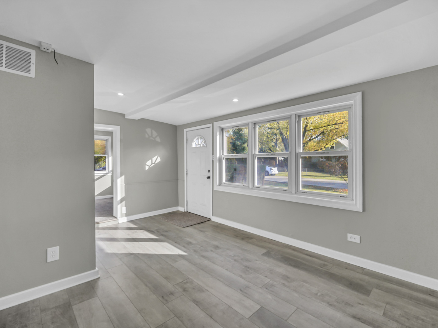 1820 Tomahawk Trail Round Lake Heights, IL 60073 - Photo 6 of 23 a view of an empty room with a window
