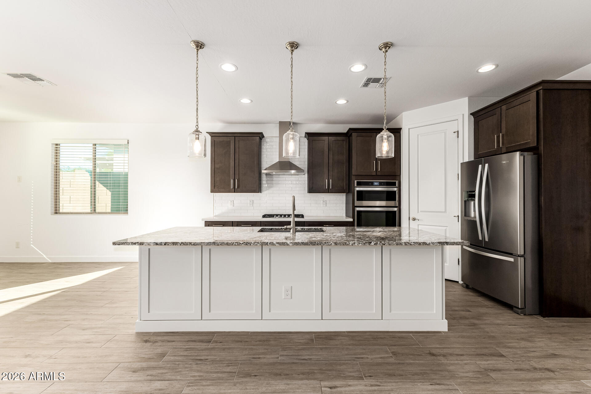 735 East Marblewood Way Phoenix, AZ 85048 - Photo 12 of 35 a kitchen with stainless steel appliances granite countertop a refrigerator a sink and a stove