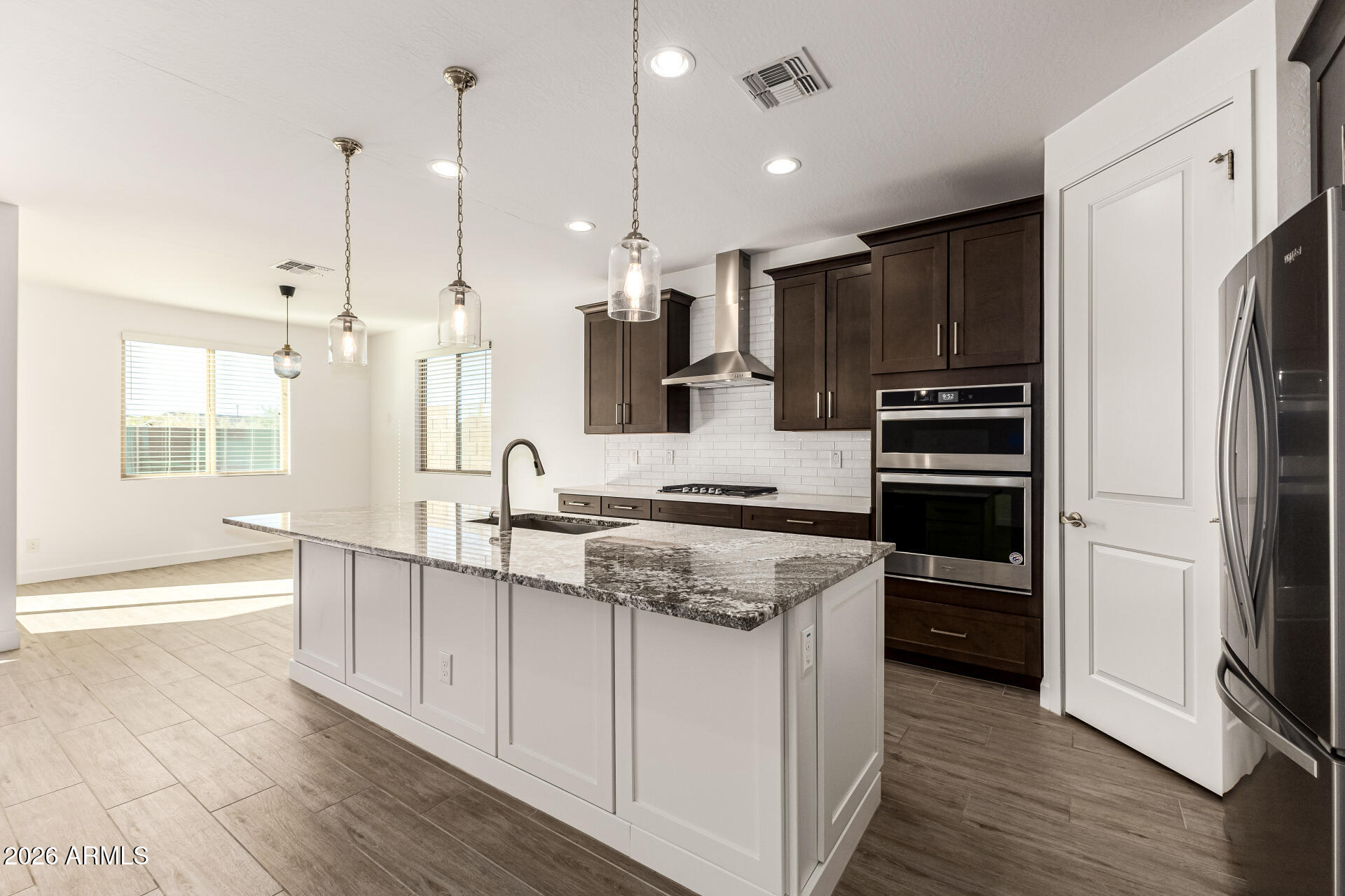 735 East Marblewood Way Phoenix, AZ 85048 - Photo 13 of 35 a kitchen with stainless steel appliances granite countertop a sink stove and refrigerator
