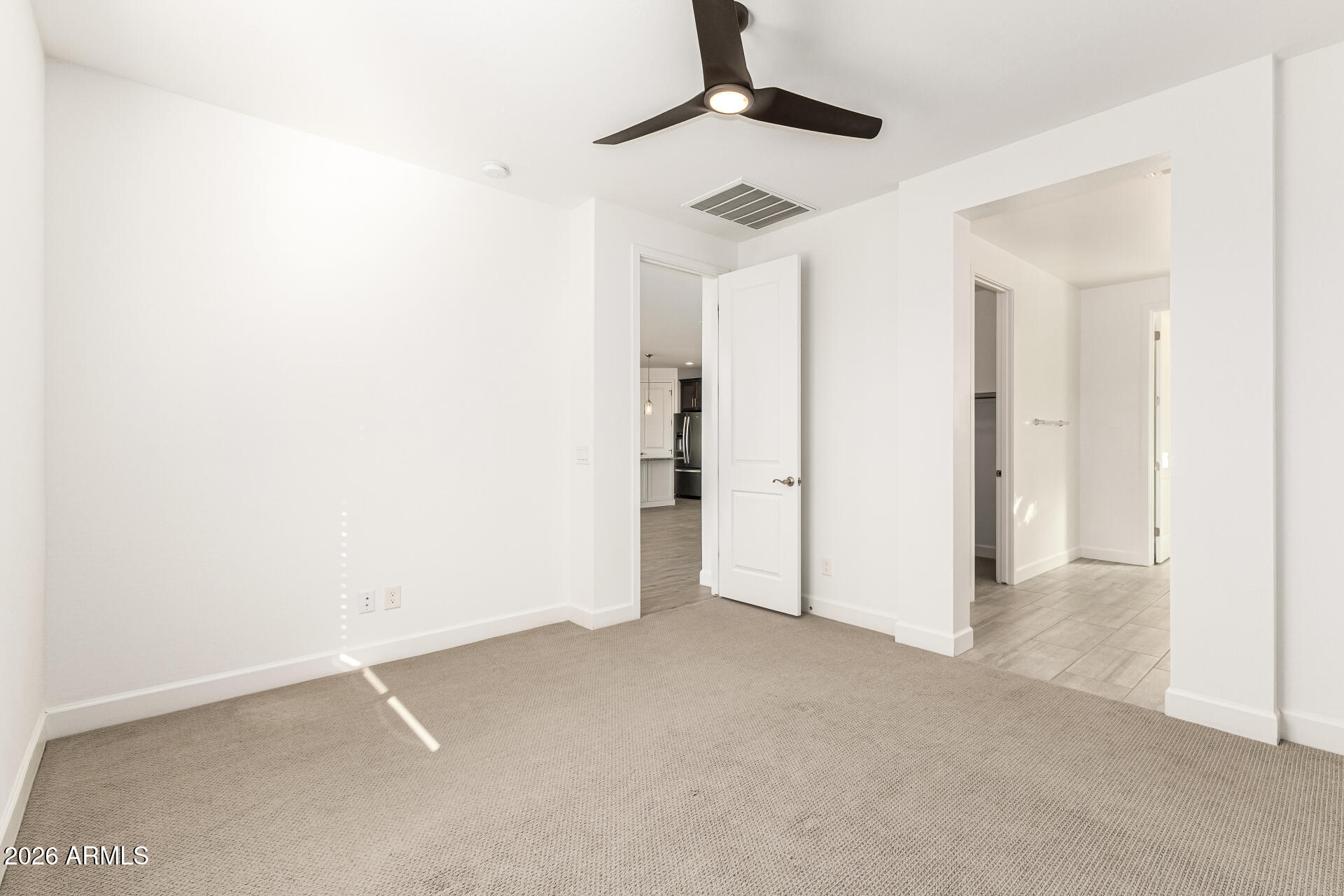735 East Marblewood Way Phoenix, AZ 85048 - Photo 18 of 35 an empty room with chandelier fan