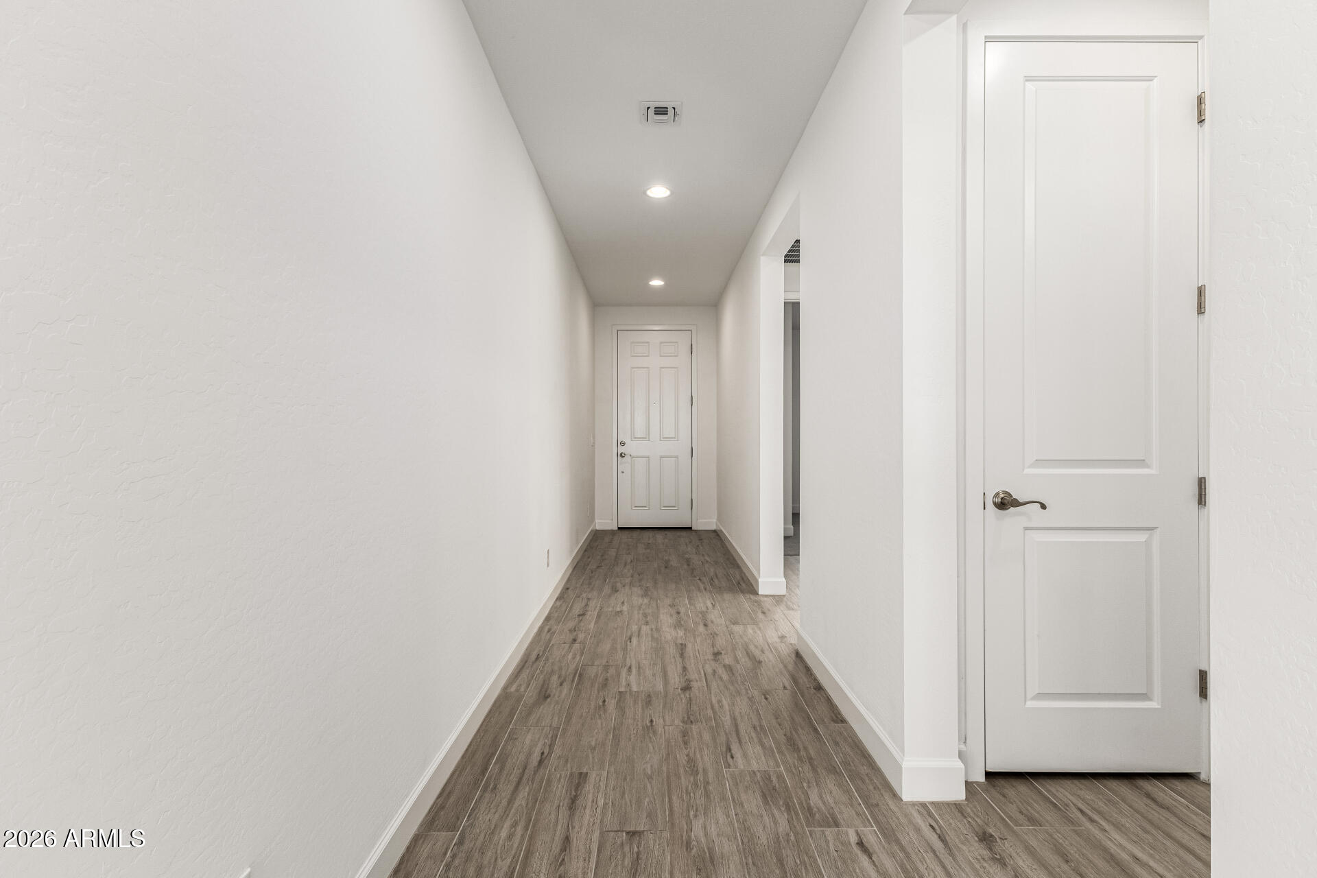 735 East Marblewood Way Phoenix, AZ 85048 - Photo 4 of 35 a view of a hallway with wooden floor