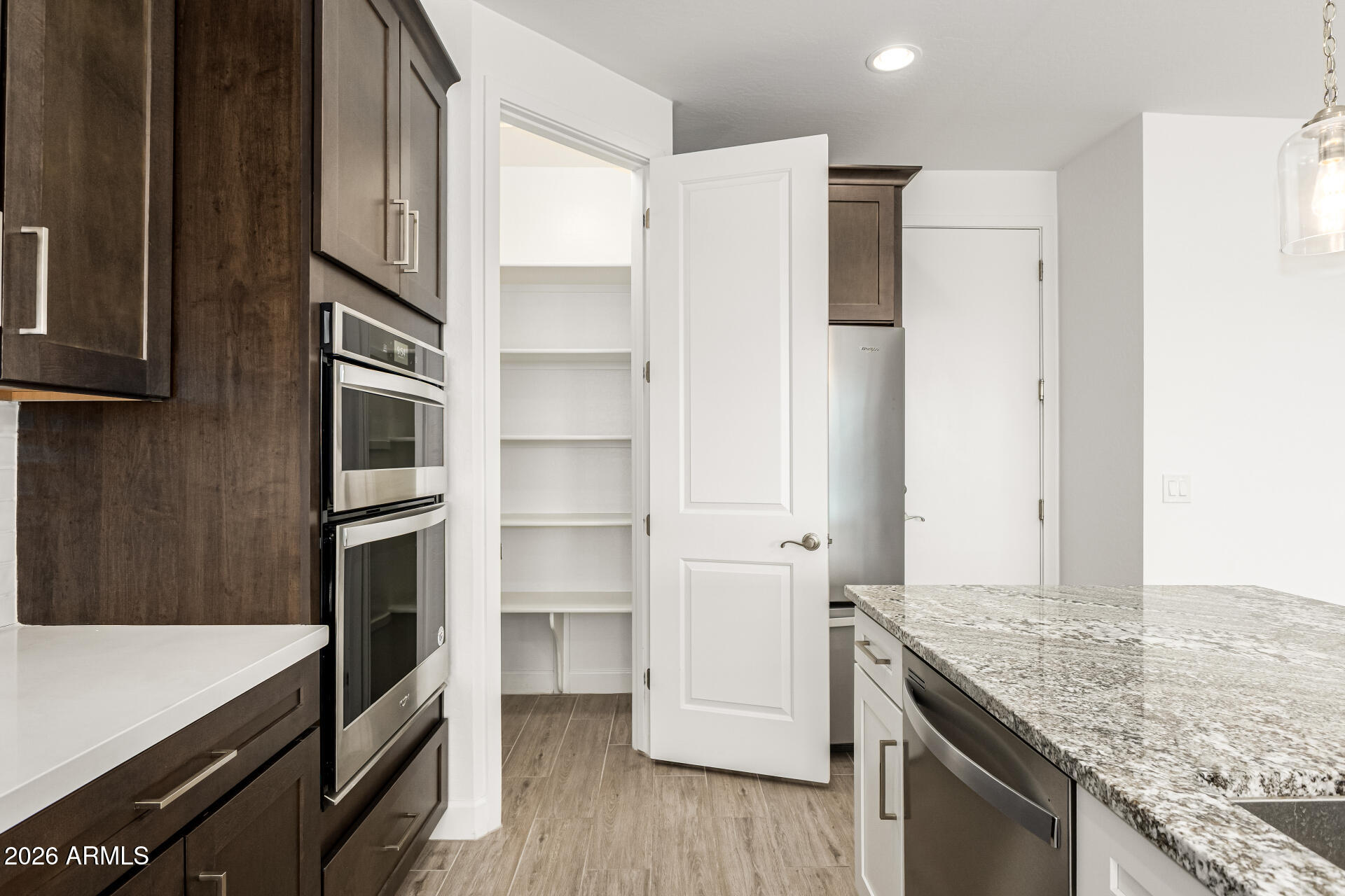 735 East Marblewood Way Phoenix, AZ 85048 - Photo 9 of 35 a kitchen with stainless steel appliances granite countertop a refrigerator and a stove