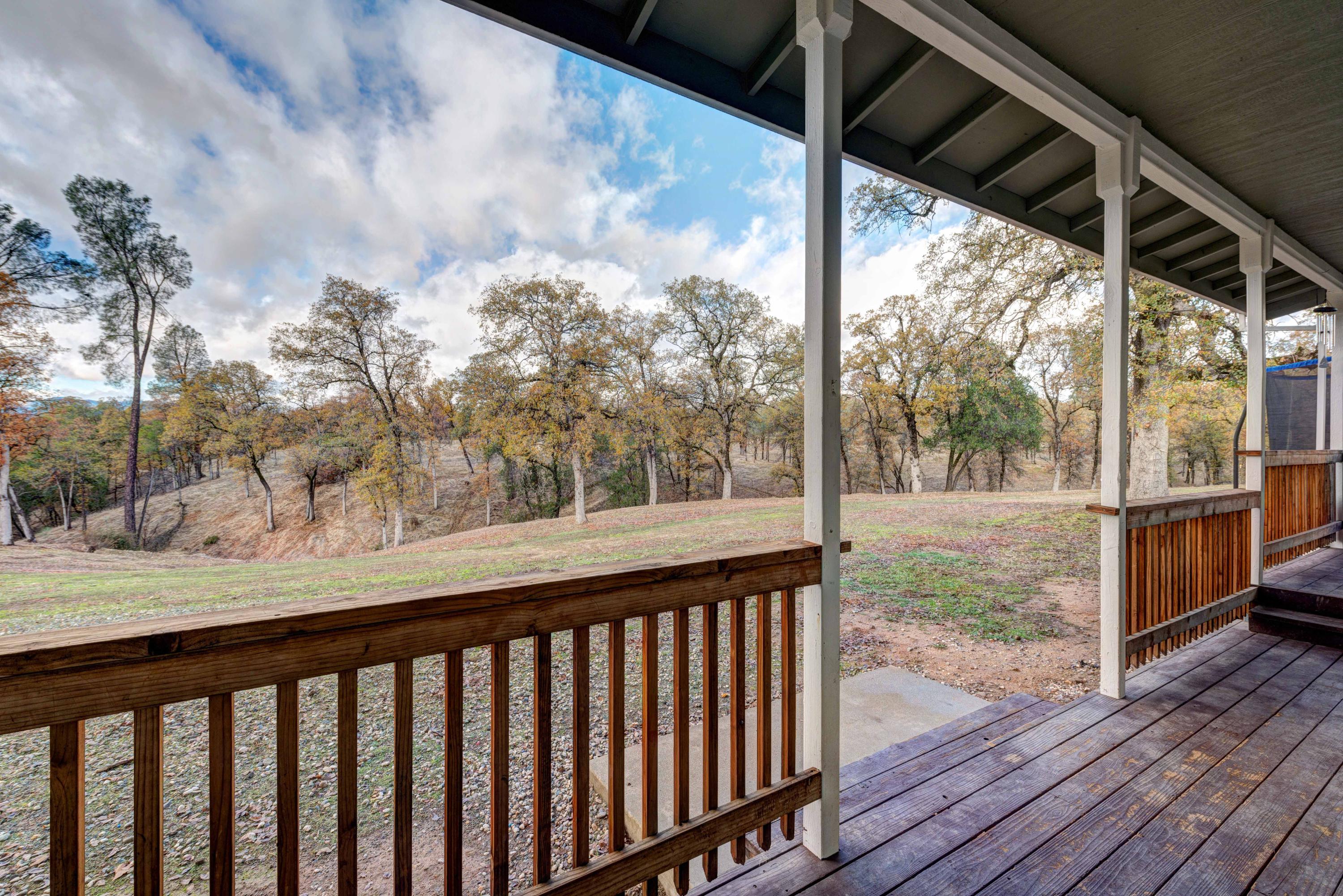 13711 Gas Point Road Igo, CA 96047 - Photo 21 of 29 a view of a balcony with wooden floor