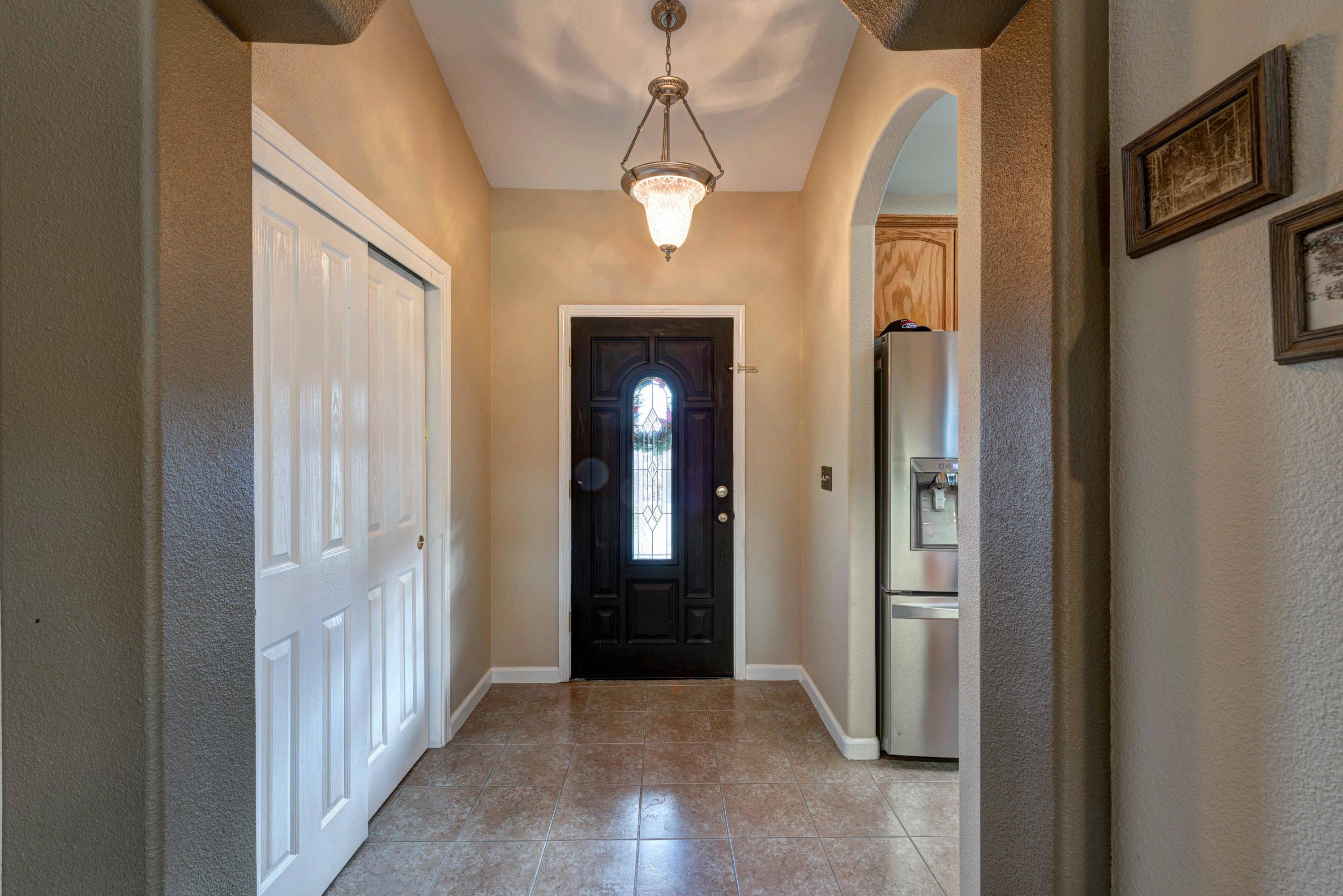 13711 Gas Point Road Igo, CA 96047 - Photo 5 of 29 a view of a hallway with wooden floor and windows