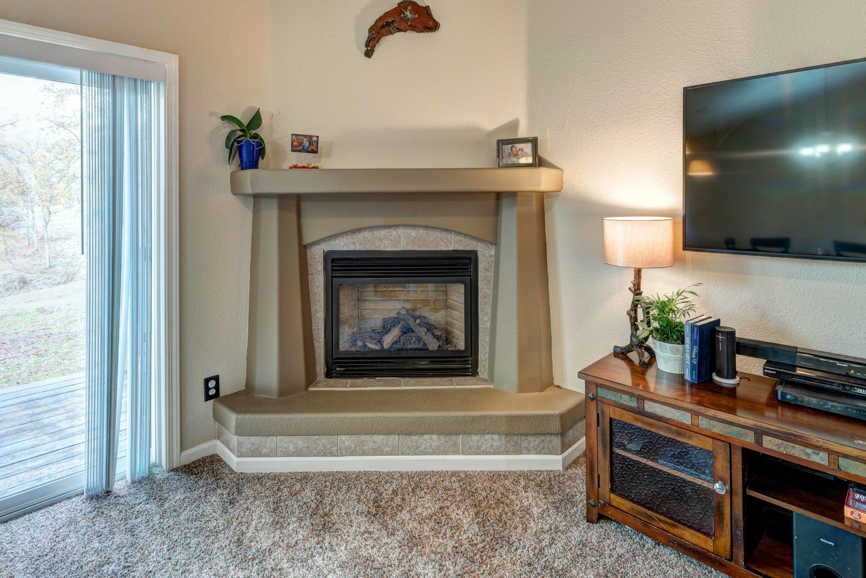 13711 Gas Point Road Igo, CA 96047 - Photo 7 of 29 a living room with furniture and a fireplace