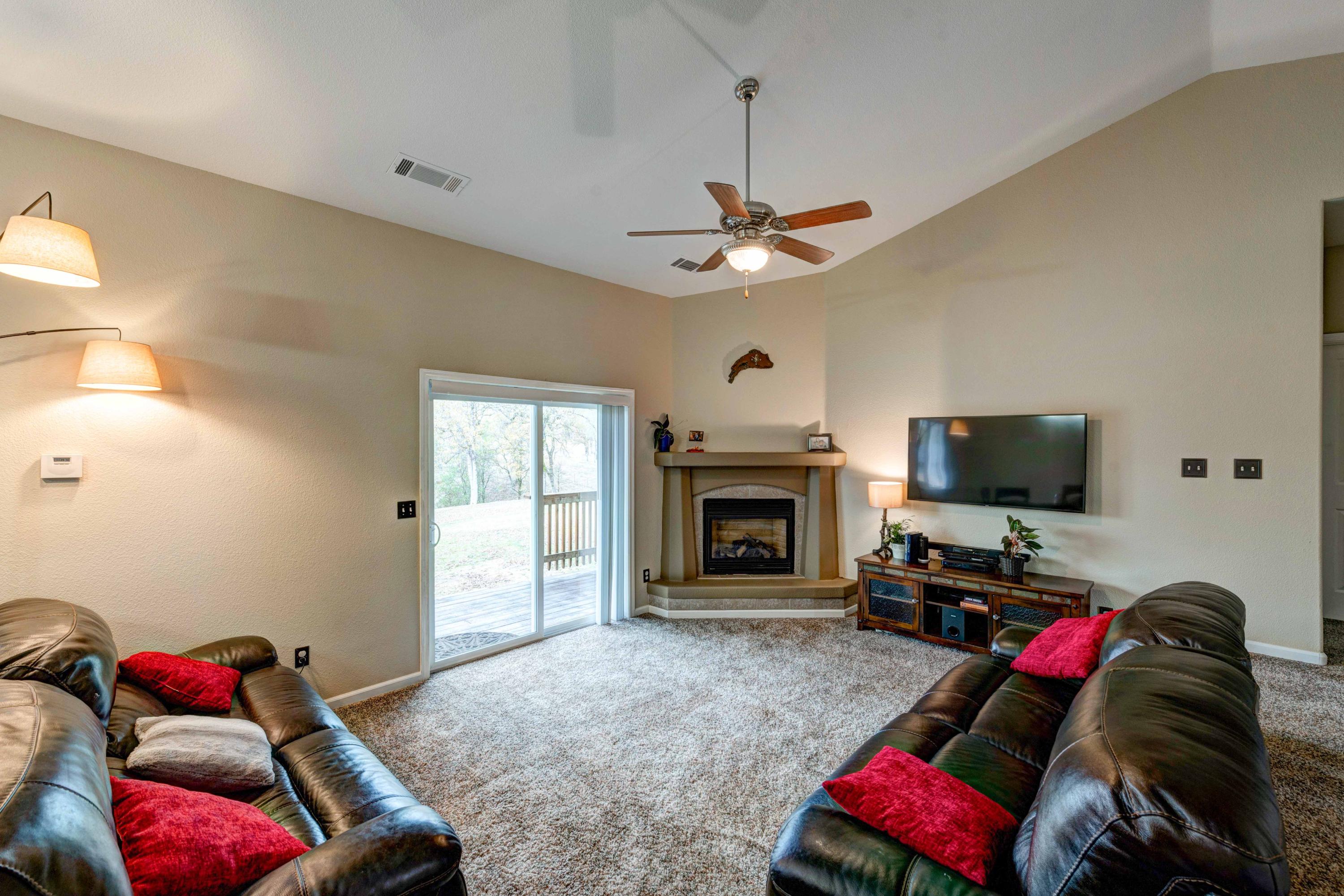 13711 Gas Point Road Igo, CA 96047 - Photo 8 of 29 a living room with furniture and a flat screen tv