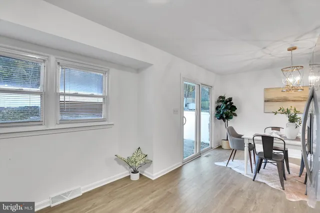 a view of a livingroom with furniture window and wooden floor