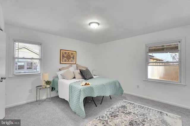 a bed room with a bed and a window