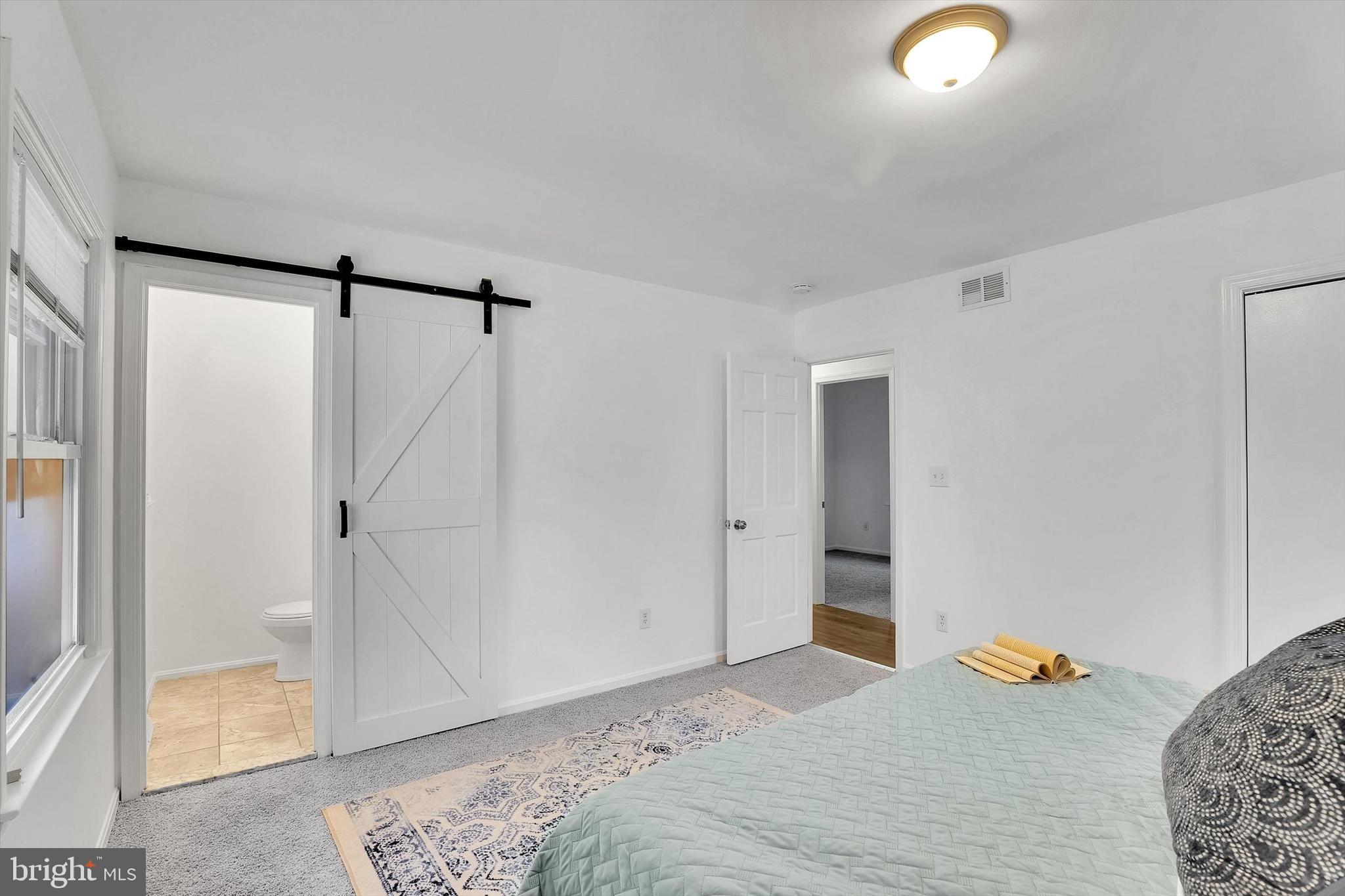560 Edwards Drive Odenton, MD 21113 - Photo 19 of 39 a bedroom with a bed and a shower