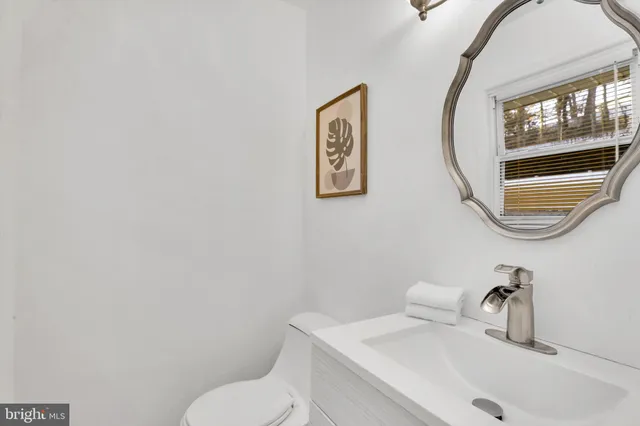 a bathroom with a toilet and a sink