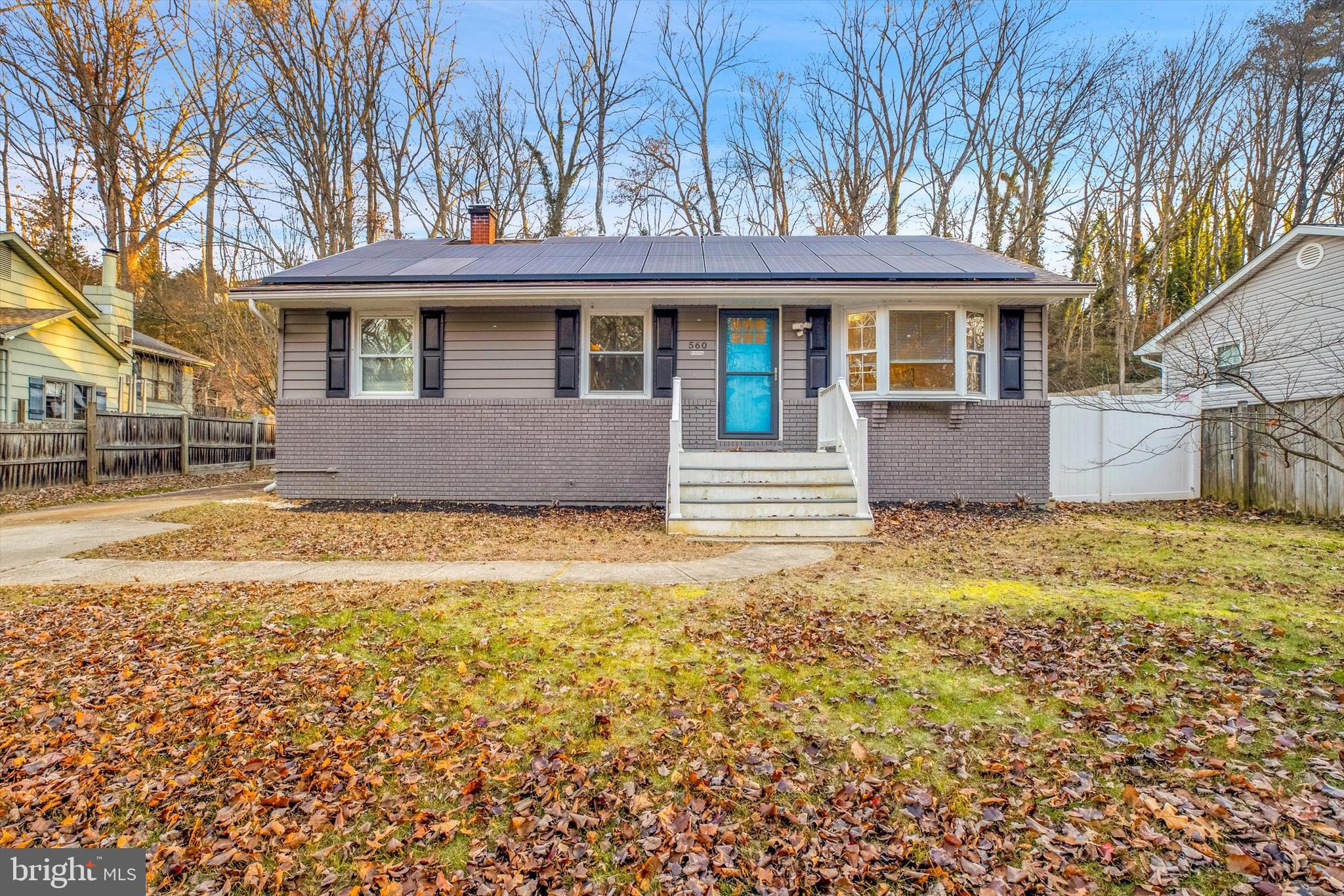 560 Edwards Drive Odenton, MD 21113 - Photo 2 of 39 a front view of a house with a garden