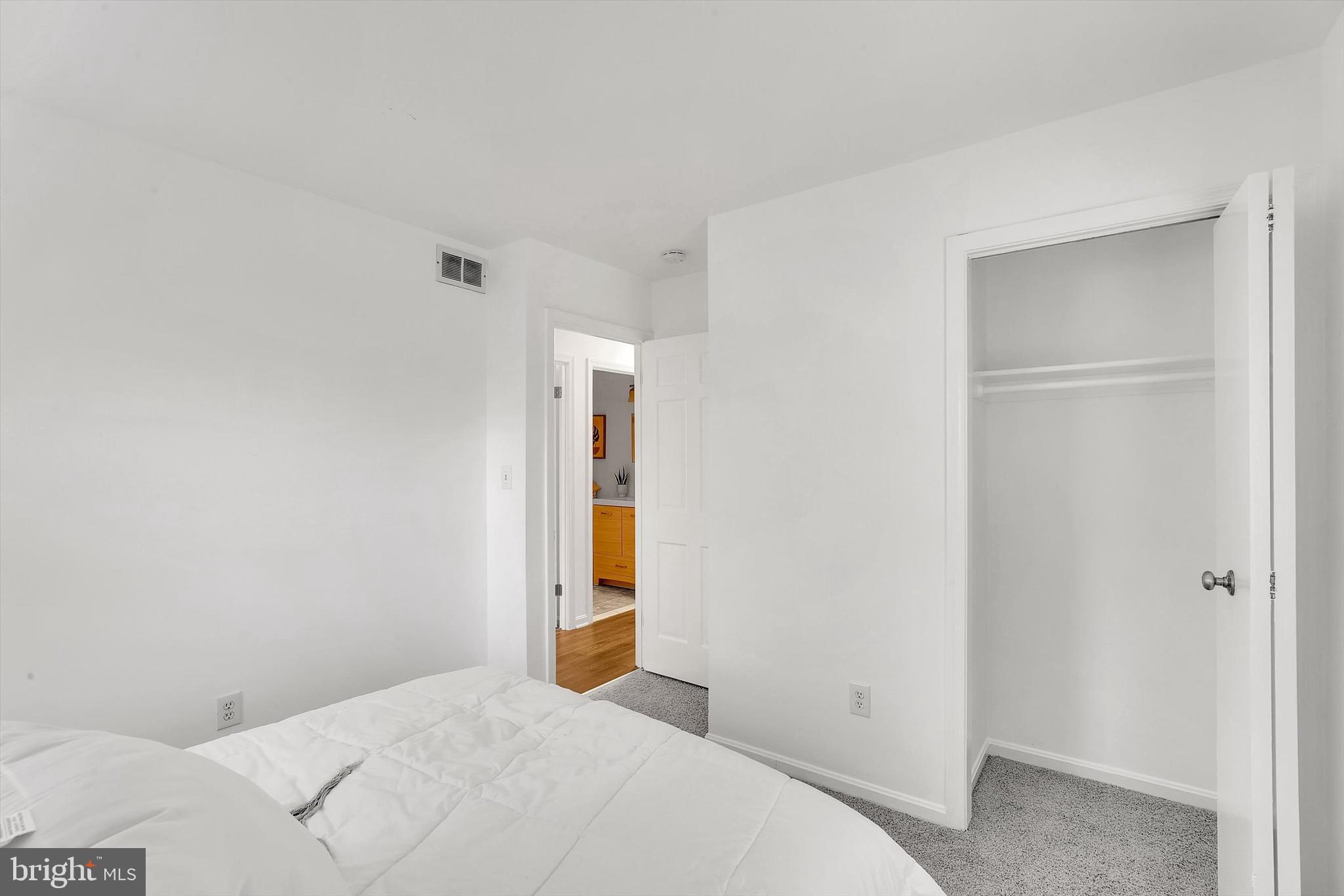 560 Edwards Drive Odenton, MD 21113 - Photo 22 of 39 a bedroom with a bed and a hallway