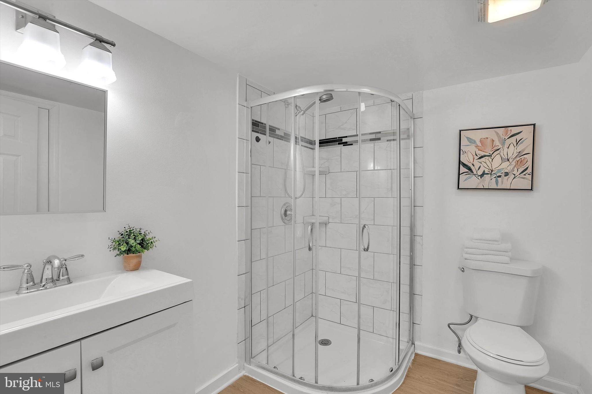 560 Edwards Drive Odenton, MD 21113 - Photo 29 of 39 a bathroom with a sink toilet and shower