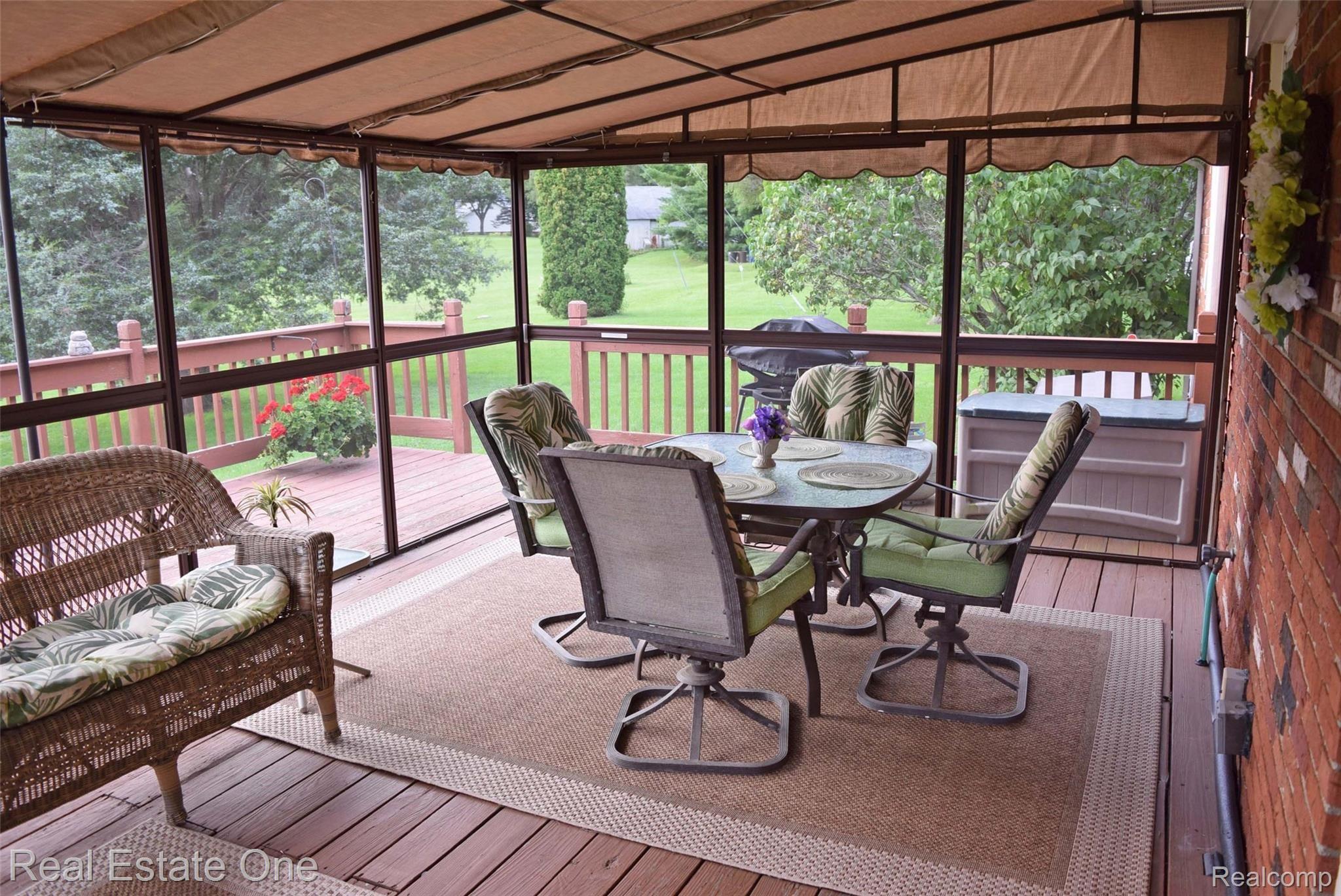 450 Taylor Road Brighton, MI 48114 - Photo 22 of 32 Better view of the screened in porch. The outdoor furniture is included in the sale.