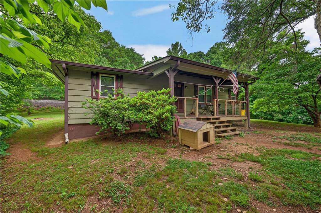 4399 Highway 411 Rydal, GA 30171 - Photo 26 of 37 front view of a house with a garden