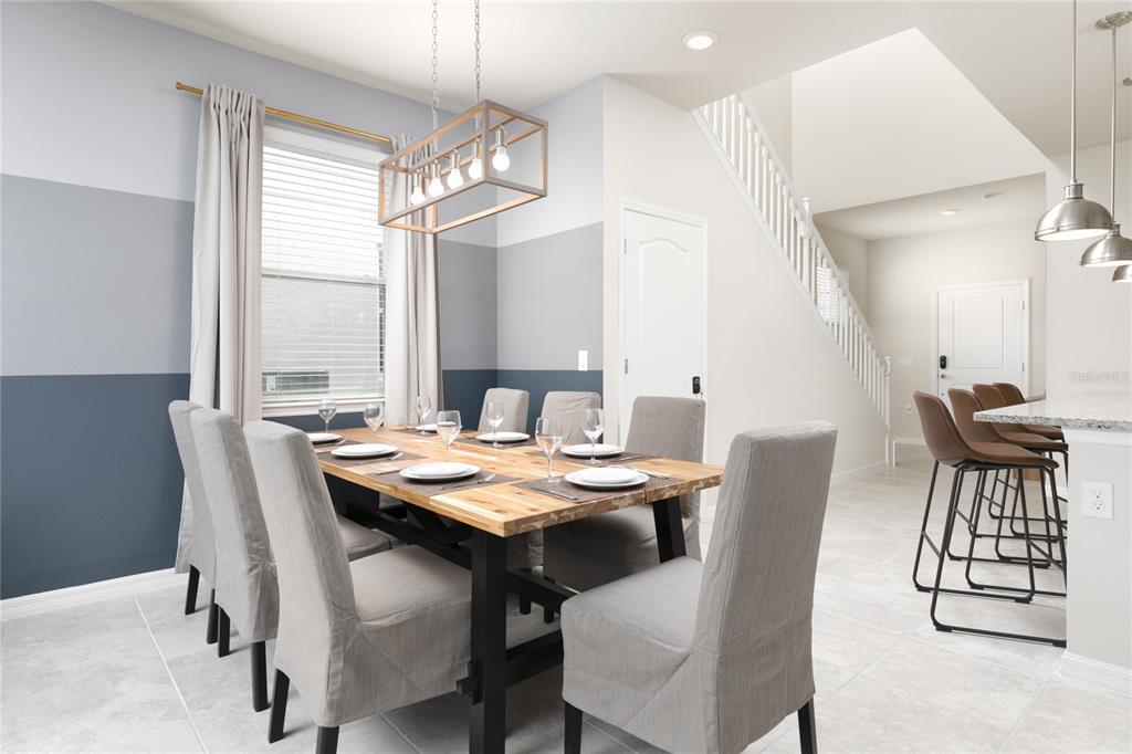 7208 Oakmoss Loop Davenport, FL 33837 - Photo 12 of 46 a view of a dining room with furniture and window