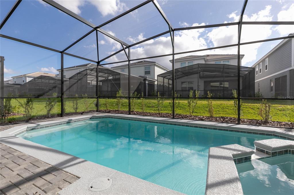 7208 Oakmoss Loop Davenport, FL 33837 - Photo 37 of 46 a view of a swimming pool with a yard