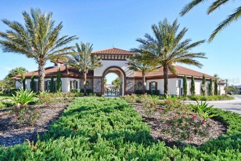 7208 Oakmoss Loop Davenport, FL 33837 - Photo 46 of 46 a front view of a house with a garden