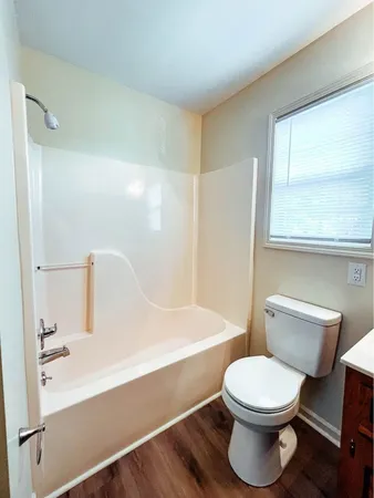 a bathroom with a toilet a sink and a bathtub
