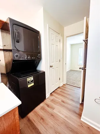 a view of kitchen island with wooden floor