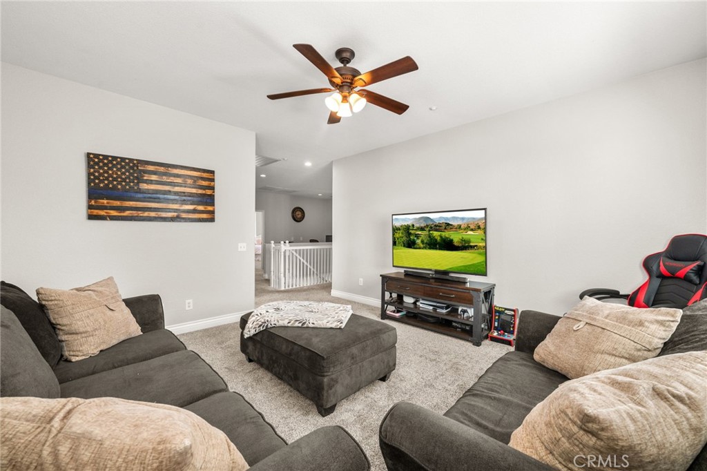 19791 Paso Robles Drive Riverside, CA 92508 - Photo 13 of 29 a living room with furniture and a flat screen tv