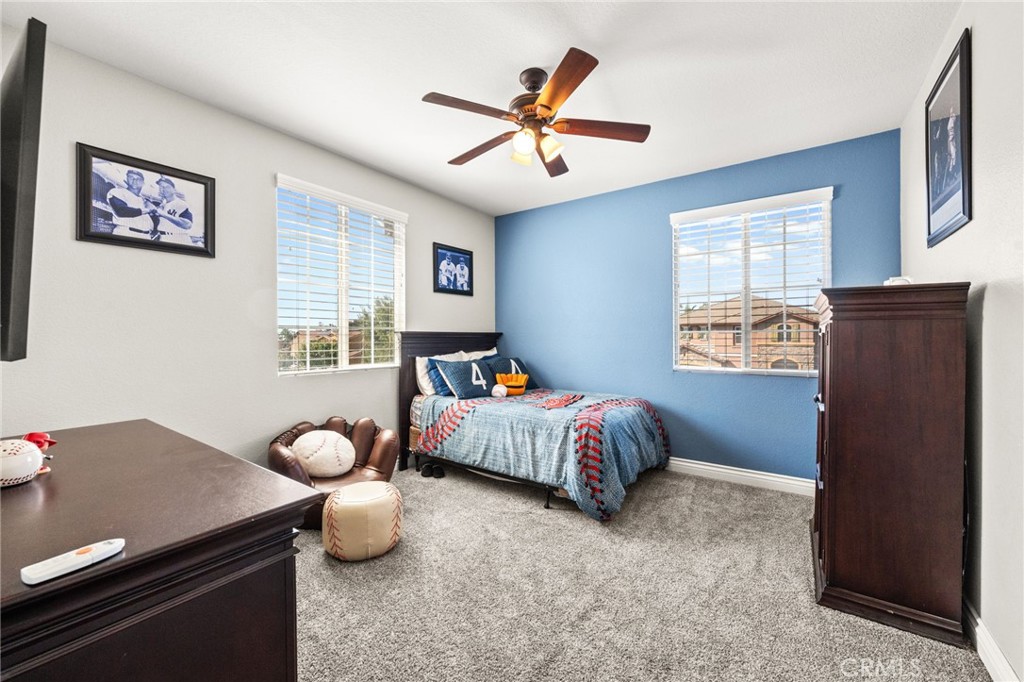 19791 Paso Robles Drive Riverside, CA 92508 - Photo 16 of 29 a bedroom with a bed and window