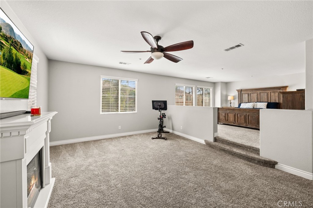 19791 Paso Robles Drive Riverside, CA 92508 - Photo 19 of 29 a view of an empty room with a window and a kitchen