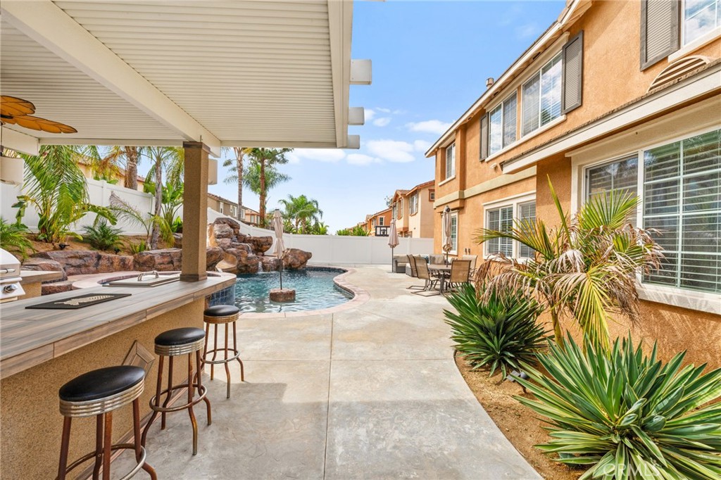 19791 Paso Robles Drive Riverside, CA 92508 - Photo 26 of 29 a building outdoor space with patio furniture and potted plants
