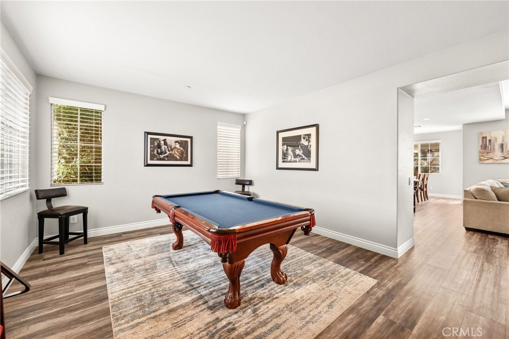 19791 Paso Robles Drive Riverside, CA 92508 - Photo 3 of 29 a room with furniture pool table wooden floor and windows
