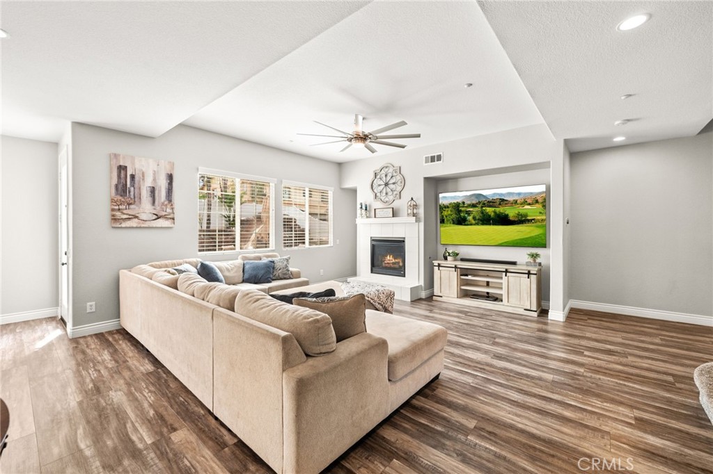 19791 Paso Robles Drive Riverside, CA 92508 - Photo 4 of 29 a living room with furniture and a flat screen tv