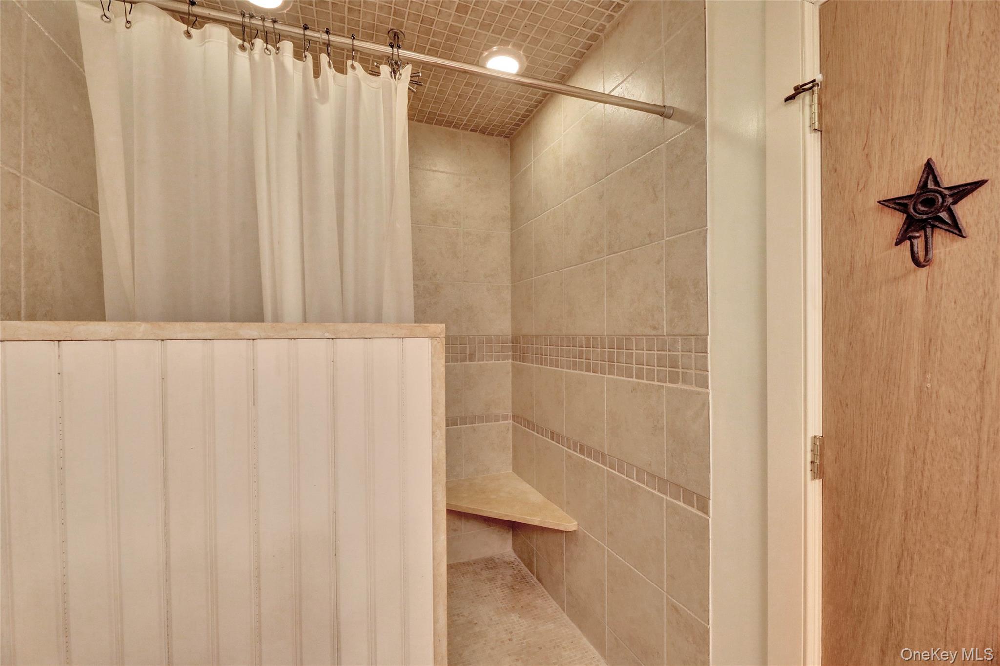 198 South Country Road Remsenburg, NY 11960 - Photo 41 of 49 a bathroom with a shower and a shower curtain
