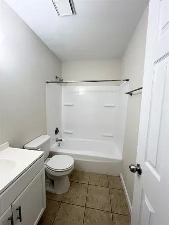 a bathroom with a toilet a sink and a shower