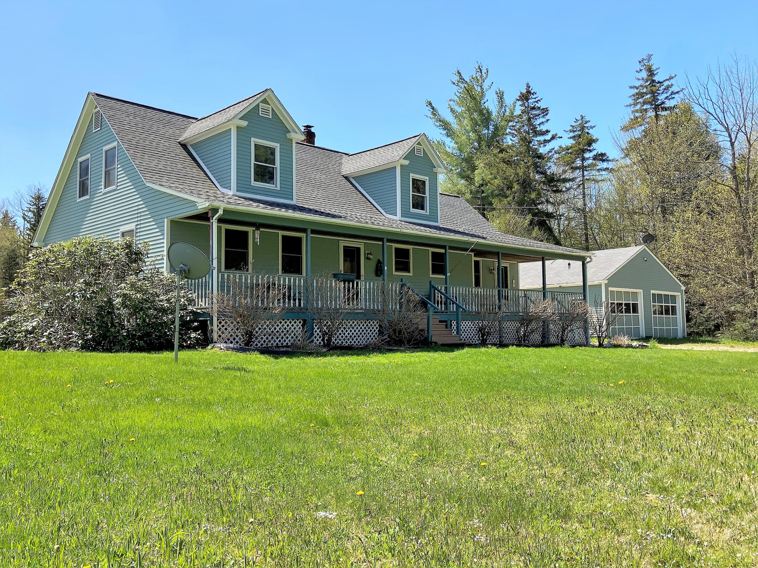 25 Groll Road Heath, MA 01346 - Photo 1 of 23 a front view of a house with a yard and trees