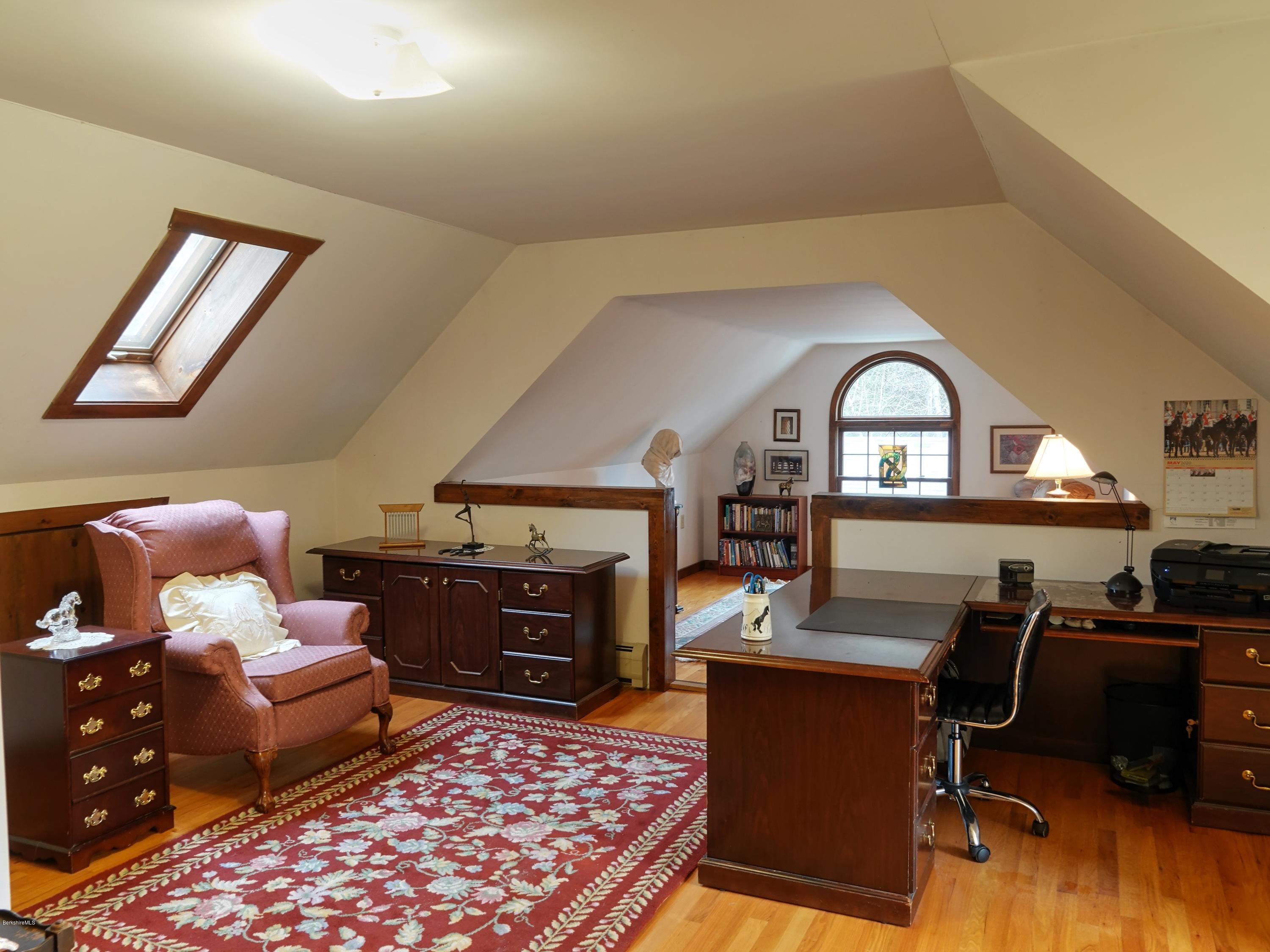 25 Groll Road Heath, MA 01346 - Photo 15 of 23 a living room with furniture a rug and a fireplace