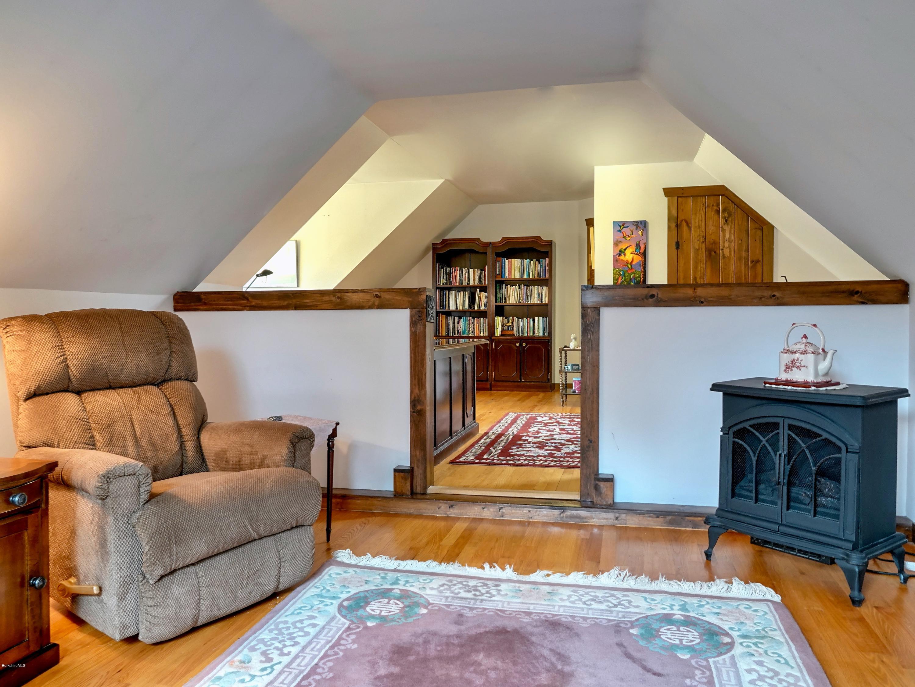 25 Groll Road Heath, MA 01346 - Photo 16 of 23 a living room with furniture a rug and a fireplace