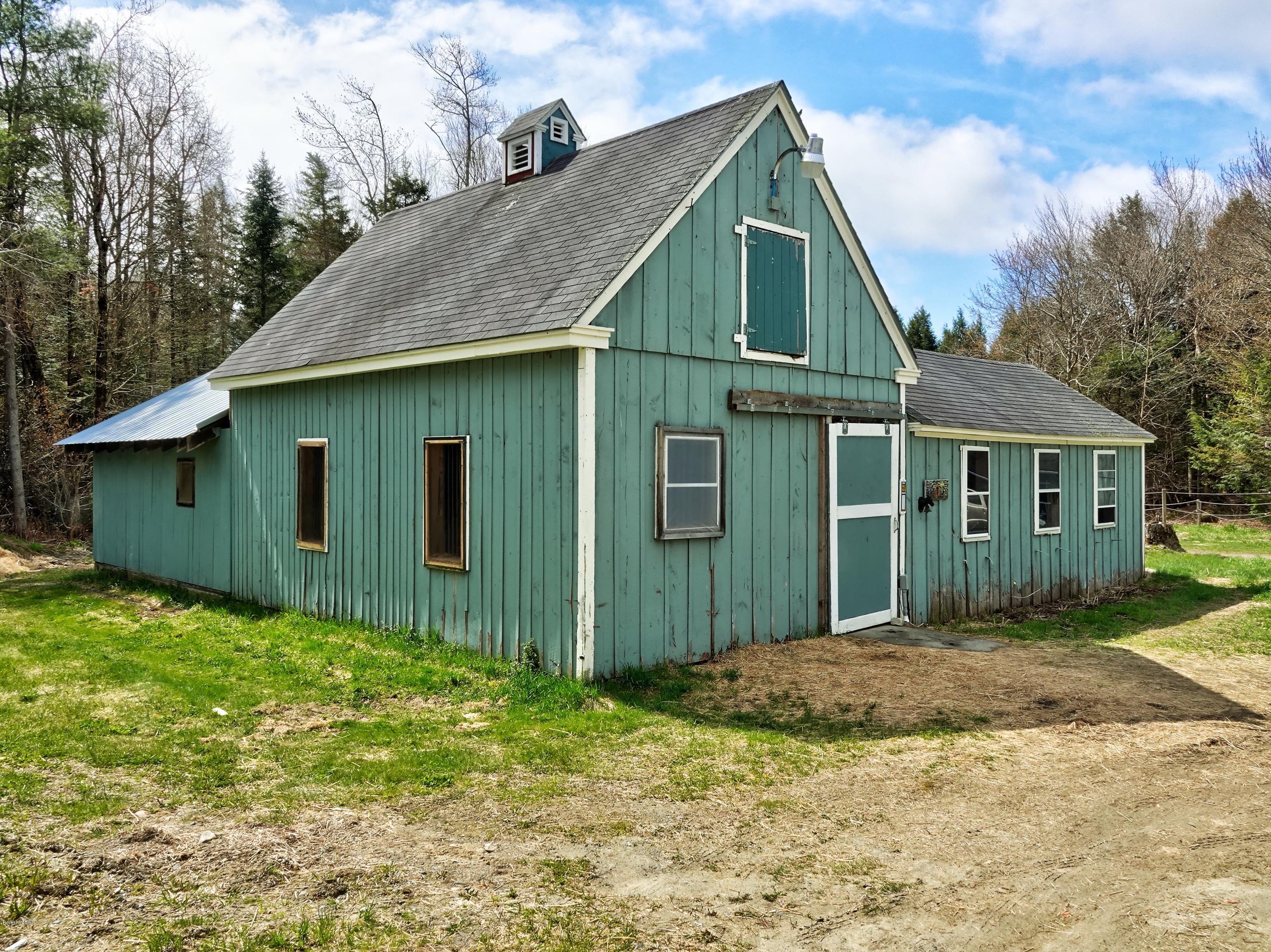 25 Groll Road Heath, MA 01346 - Photo 17 of 23 a view of a barn house in the middle of a yard