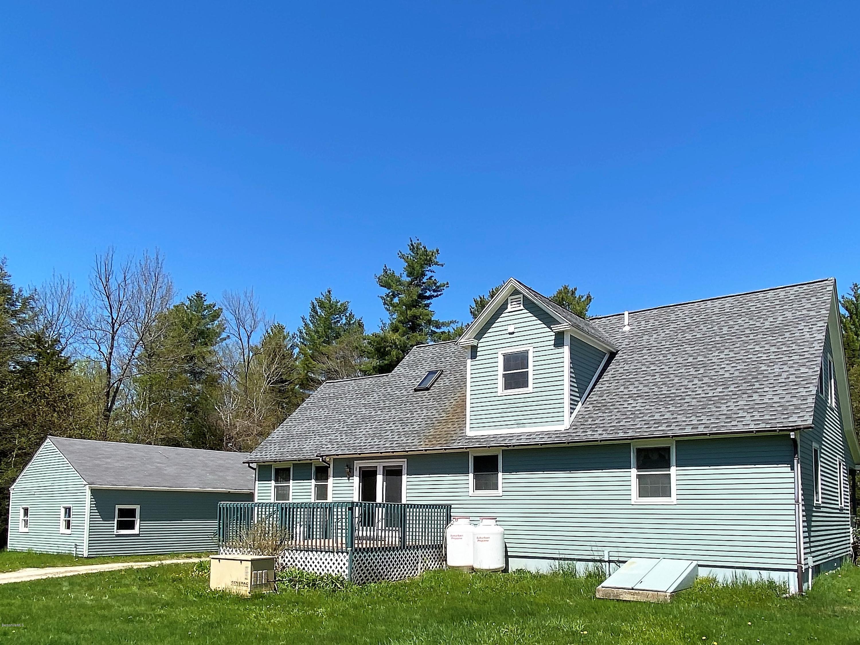 25 Groll Road Heath, MA 01346 - Photo 20 of 23 a front view of a house with a yard and garage