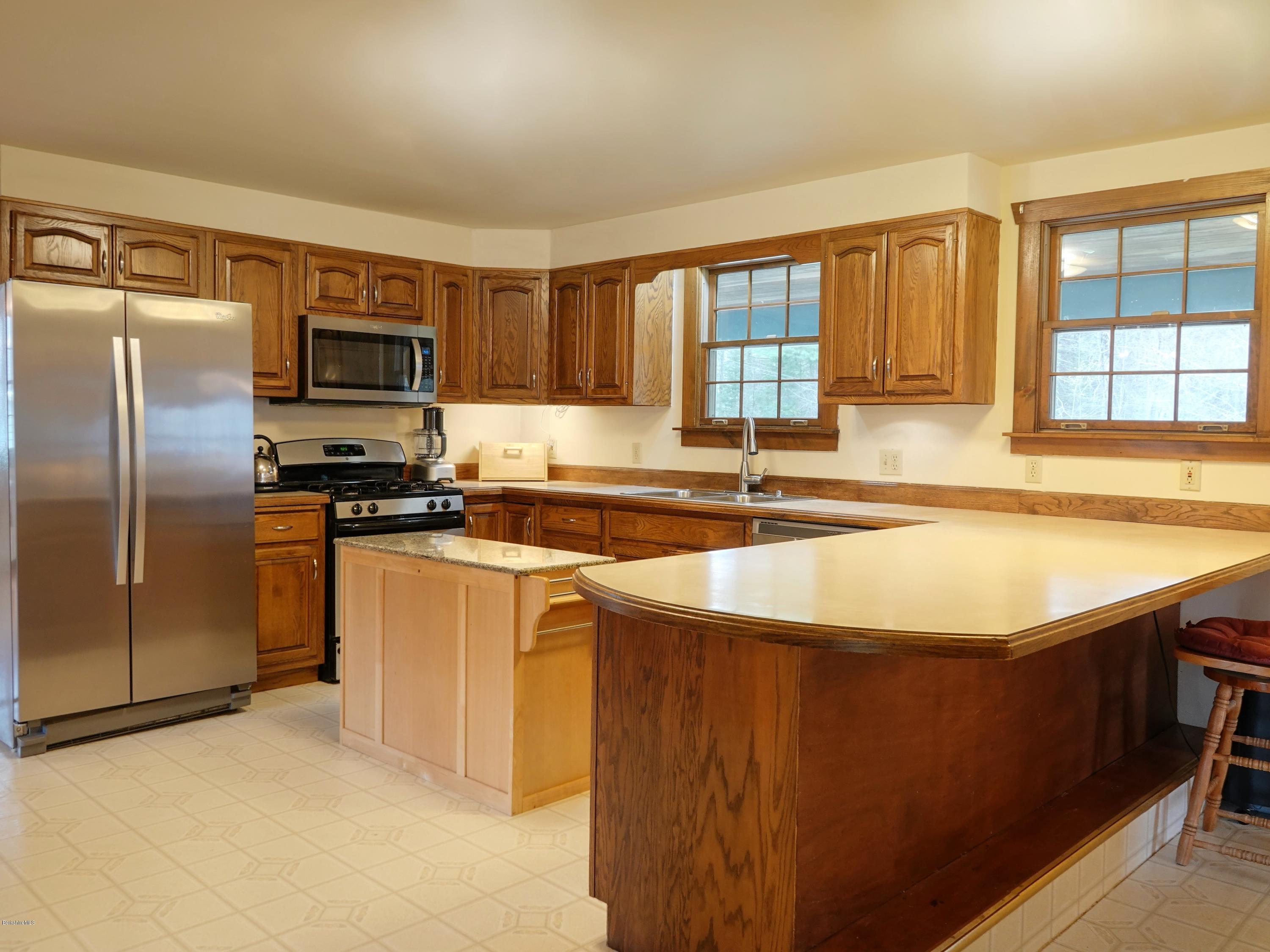 25 Groll Road Heath, MA 01346 - Photo 4 of 23 a kitchen with stainless steel appliances granite countertop a refrigerator and a sink