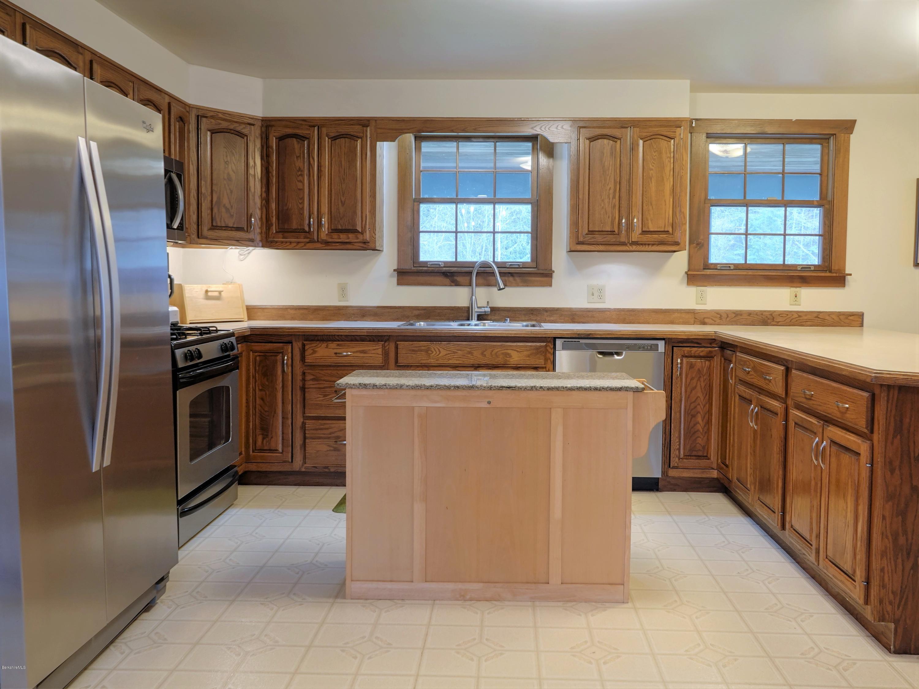 25 Groll Road Heath, MA 01346 - Photo 5 of 23 a kitchen with stainless steel appliances granite countertop a stove a sink dishwasher a refrigerator and a microwave