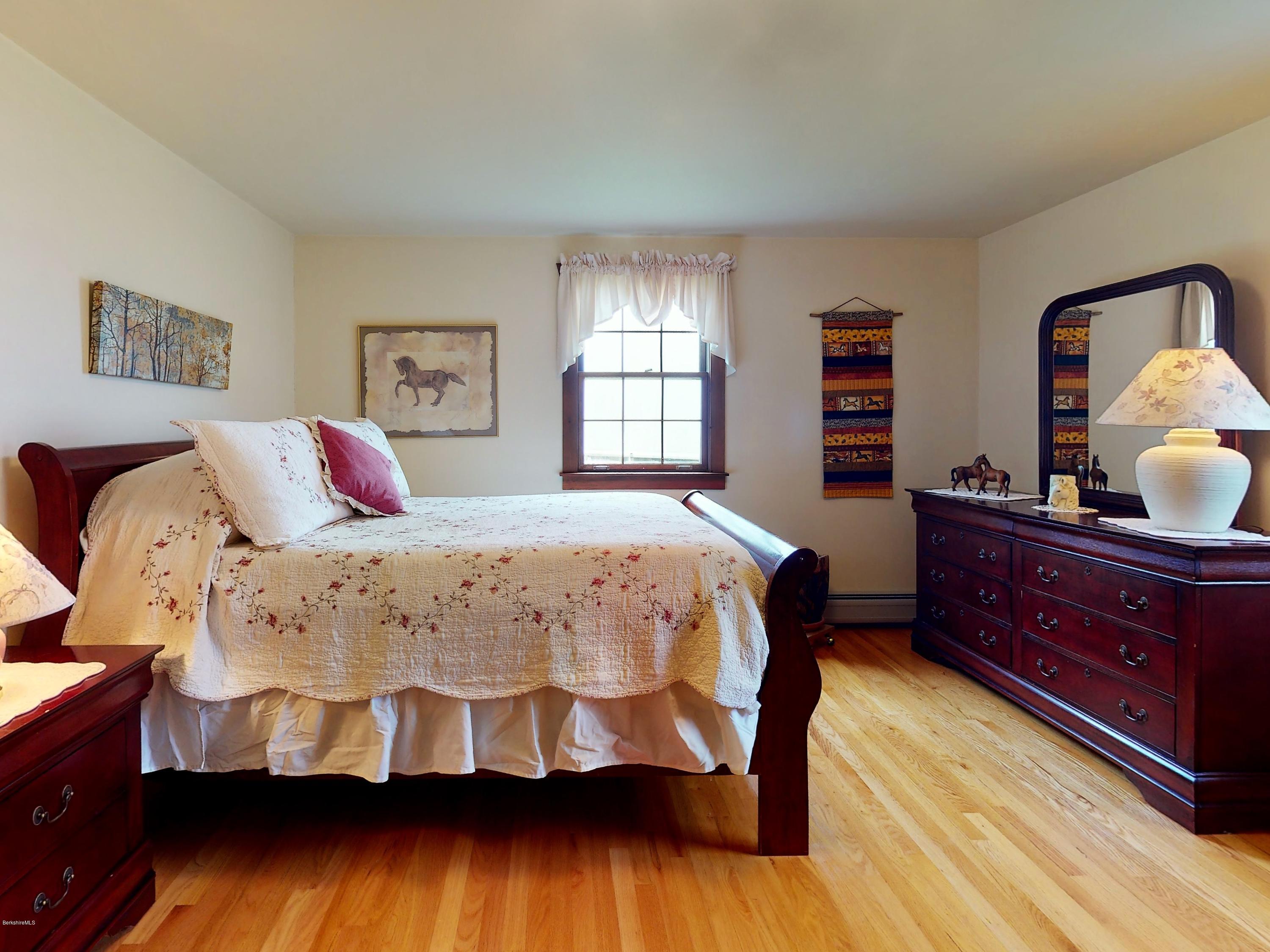 25 Groll Road Heath, MA 01346 - Photo 6 of 23 a bedroom with a bed and wooden floor