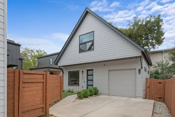 a front view of a house with garage