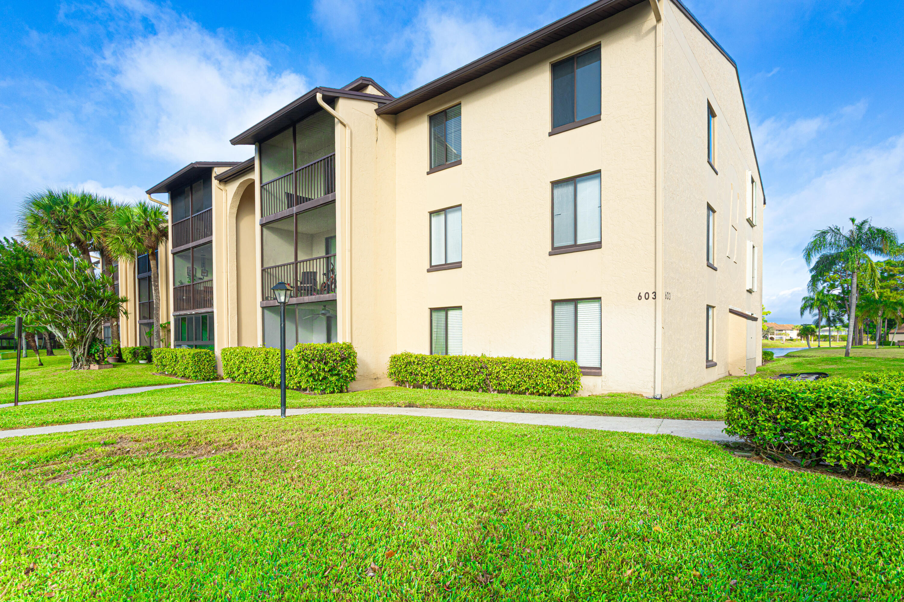 603 Sea Pine Way, Unit C1 Greenacres, FL 33415 - Photo 23 of 32 a view of a back yard of the house