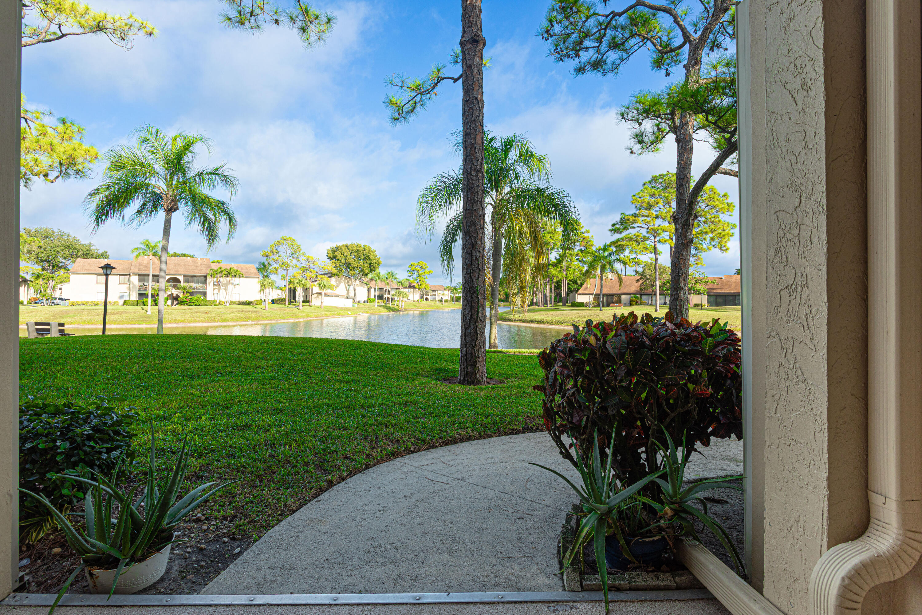 603 Sea Pine Way, Unit C1 Greenacres, FL 33415 - Photo 24 of 32 a view of a garden