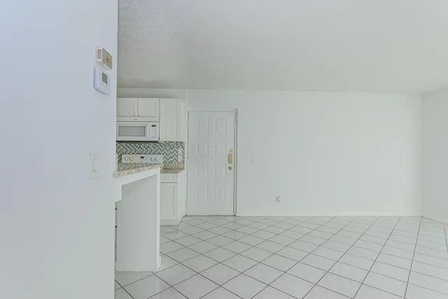 a bathroom with a shower a toilet and a sink