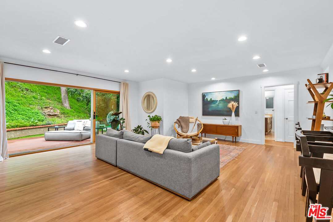 2621 Mandeville Canyon Road Los Angeles, CA 90049 - Photo 7 of 30 a living room with furniture and a large window