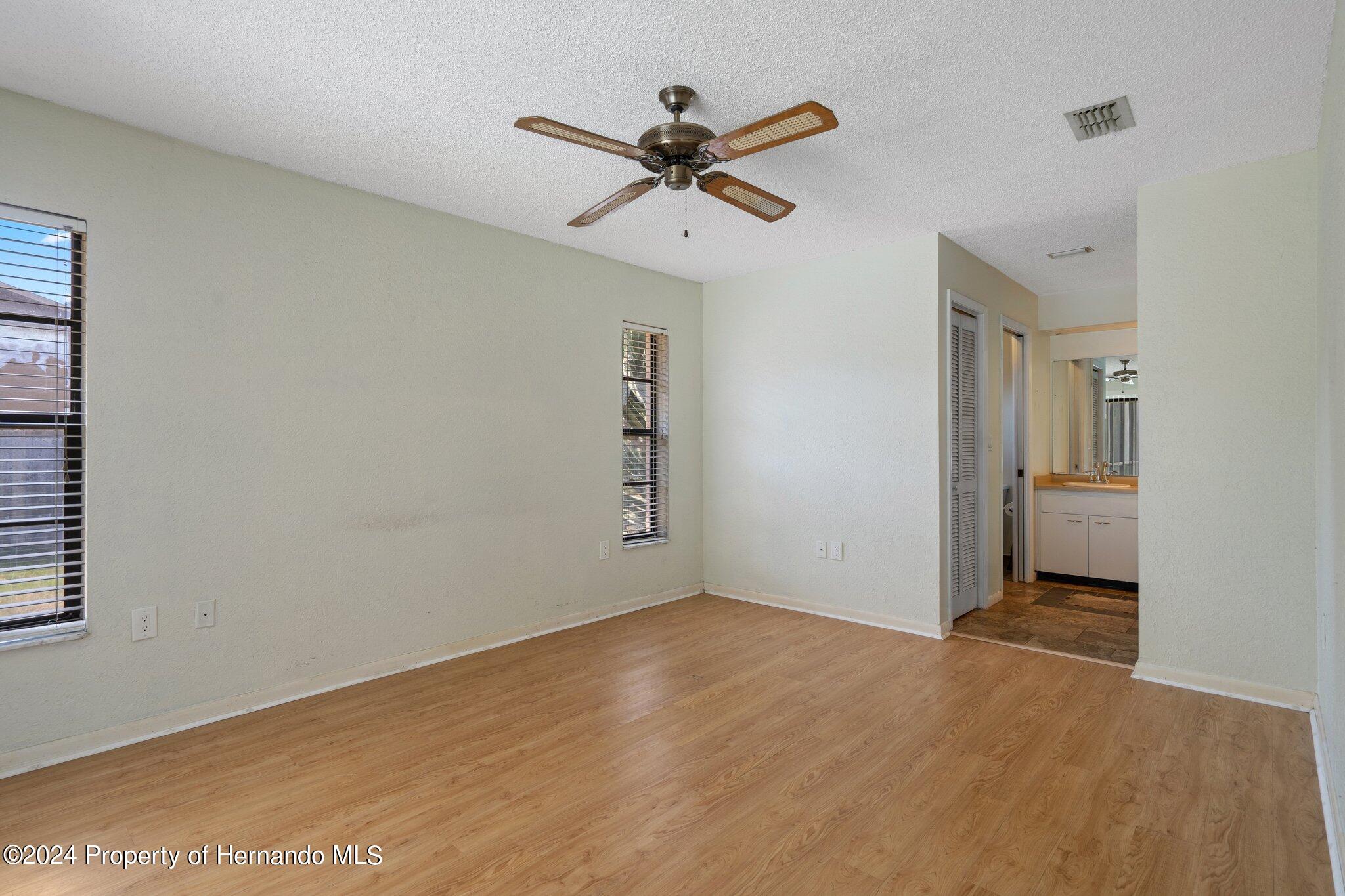 9290 Eldridge Road Spring Hill, FL 34608 - Photo 19 of 55 a view of an empty room