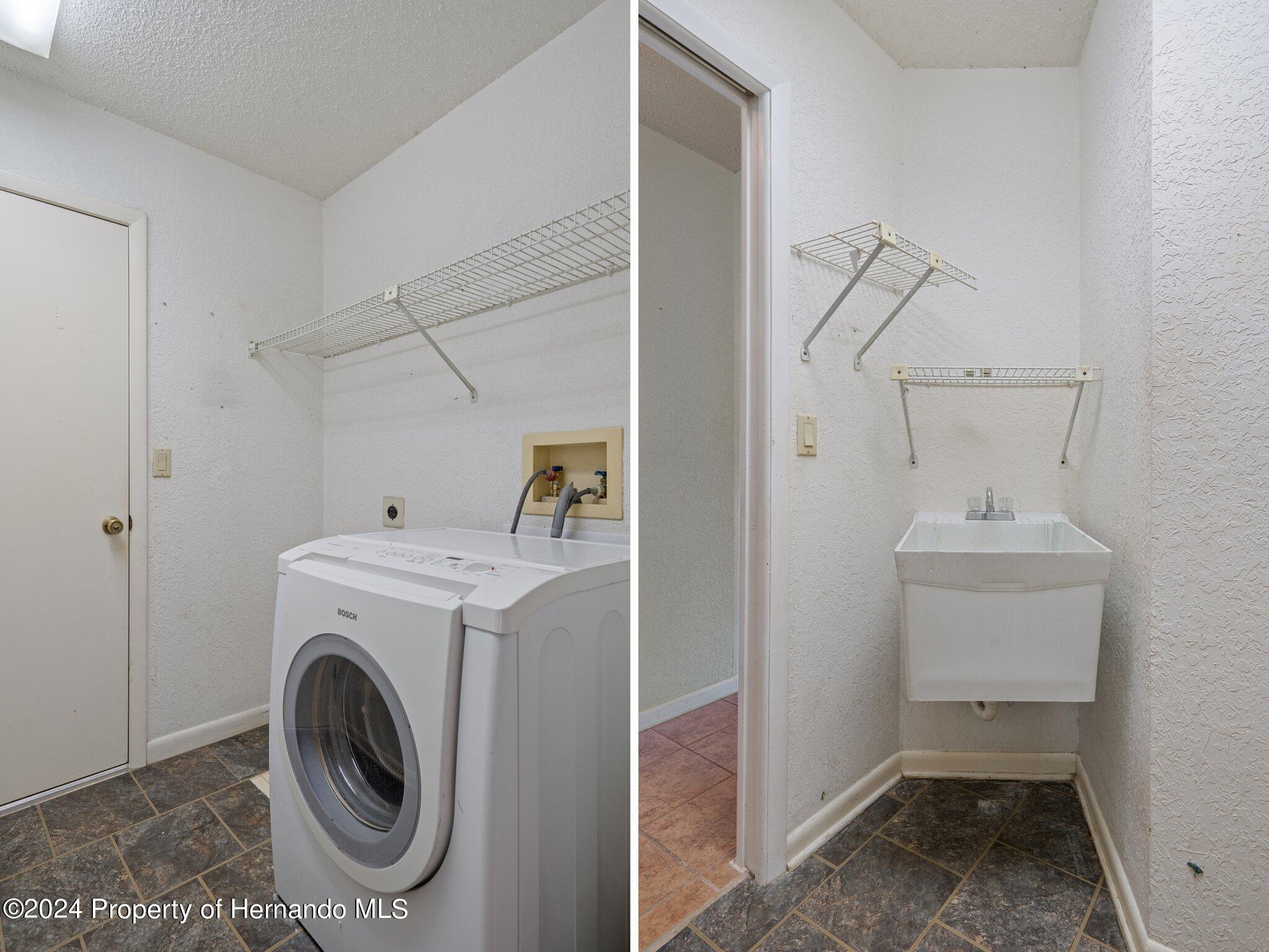 9290 Eldridge Road Spring Hill, FL 34608 - Photo 37 of 55 a utility room with dryer and washer