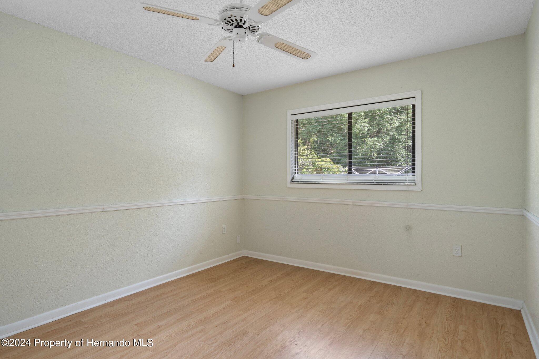 9290 Eldridge Road Spring Hill, FL 34608 - Photo 40 of 55 an empty room with a window