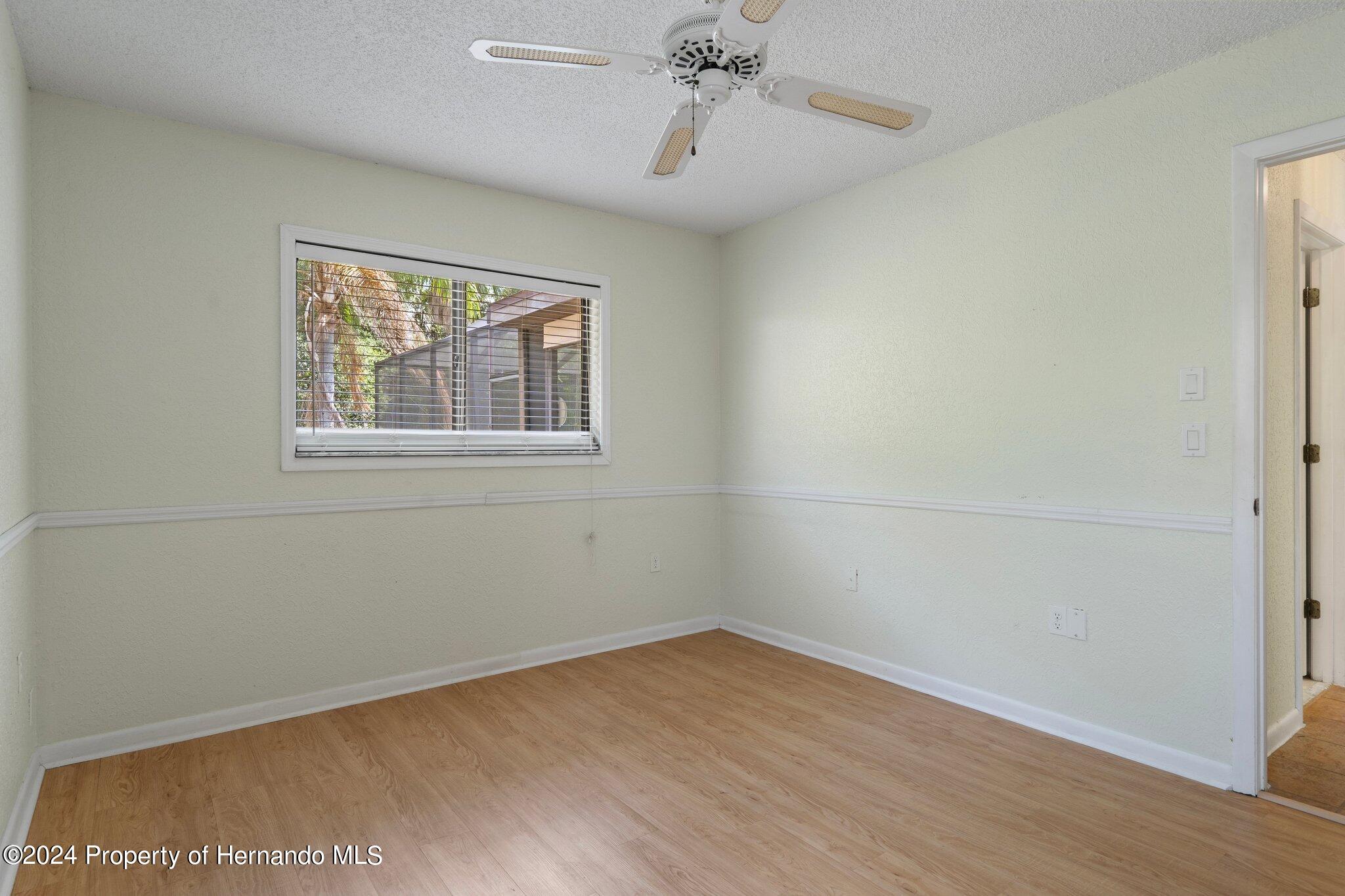 9290 Eldridge Road Spring Hill, FL 34608 - Photo 41 of 55 an empty room with a window