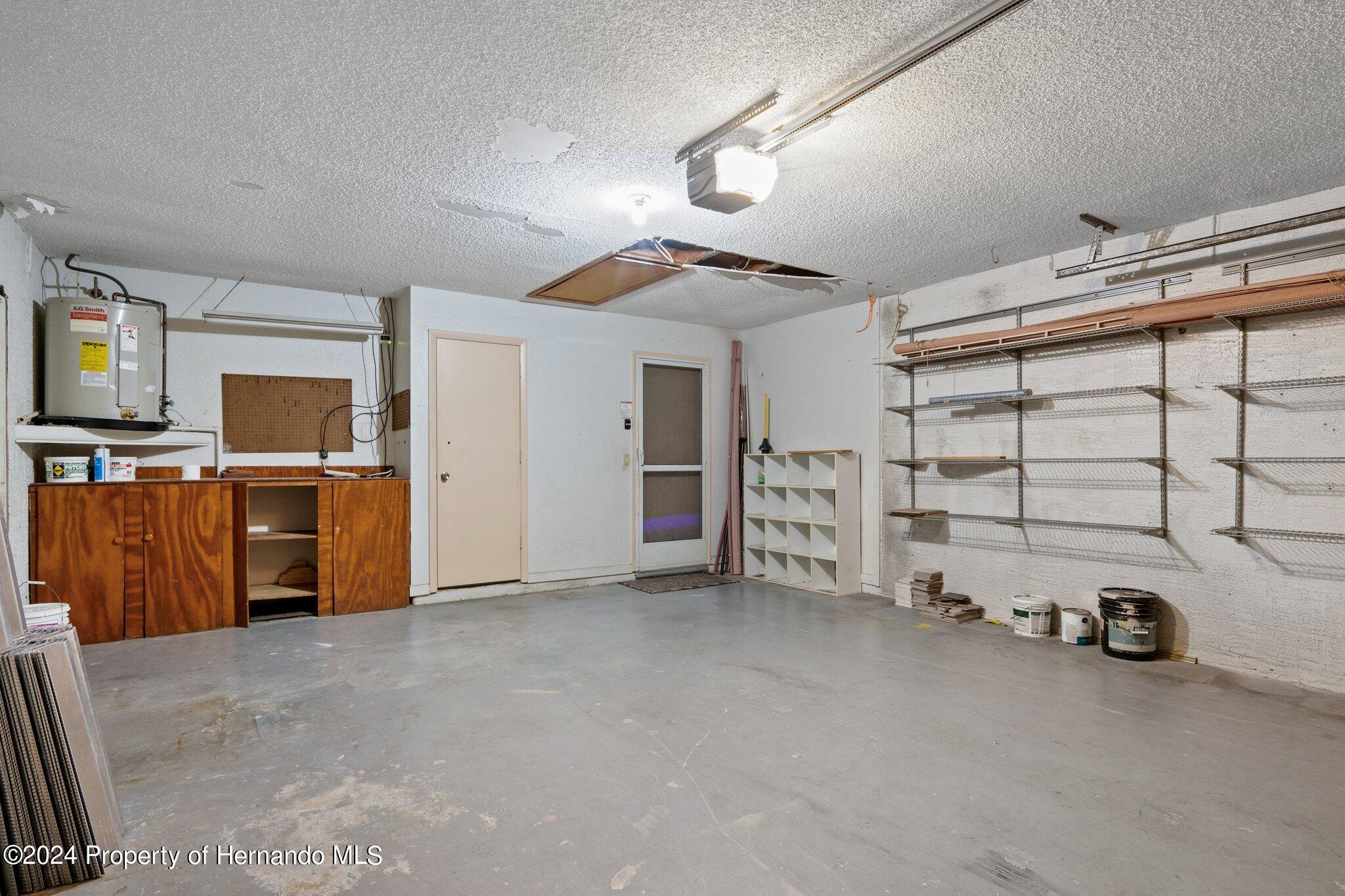 9290 Eldridge Road Spring Hill, FL 34608 - Photo 45 of 55 a view of a garage with furniture